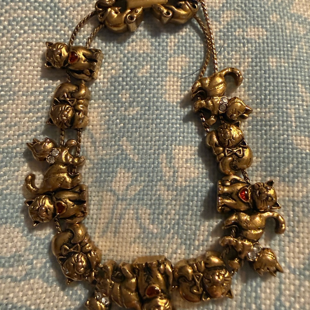 Vintage Avon Gold-Tone Cat bracelet with Red and Clear Accents